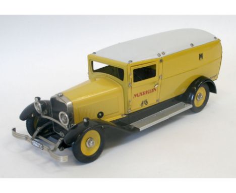  Marklin 1990 Tinplate Clockwork Postal Van Limited Edition model, yellow/white body, black chassis, with working lights in m