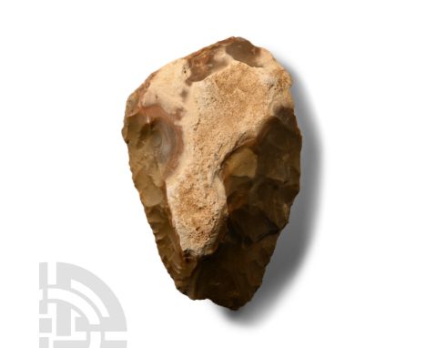 Lower Palaeolithic Period, circa 450,000-250,000 B.P. Substantial flint handaxe with a cleaver tip; crystallised mineral depo