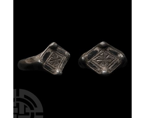 15th-16th century A.D. With flat-section hoop, carinated shoulders, scaphoid bezel with border enclosing a quatrefoil, four g