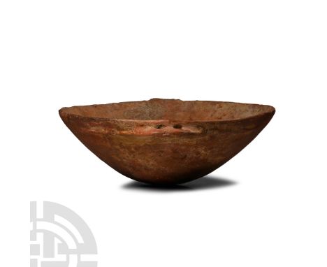 Early Bronze Age I-III, circa 2300-2000 B.C. Broad shallow bowl with rounded underside, lateral tab to the rim and pierced le