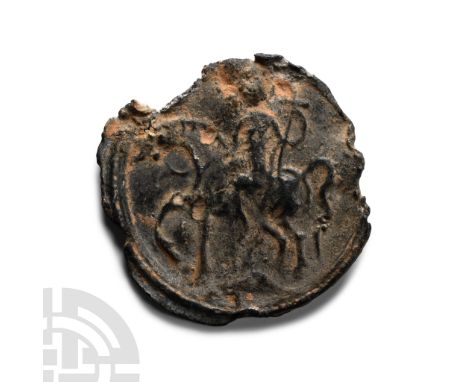 6th-7th century A.D. Bifacial amulet with chipped rim; obverse: St George with cross on horseback overcoming a dragon; revers