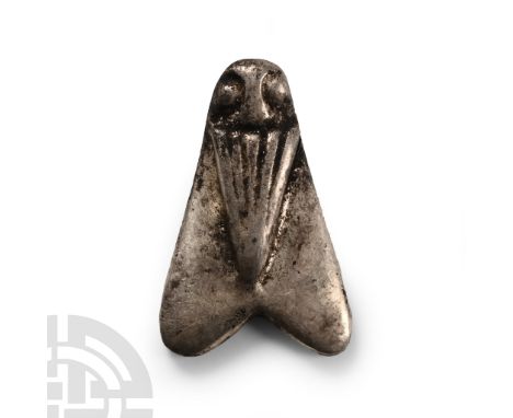 Late Period, 664-332 B.C. D-shaped in section with two triangular wings and robbed body with pellet eyes. Cf. Andrews, C., Am