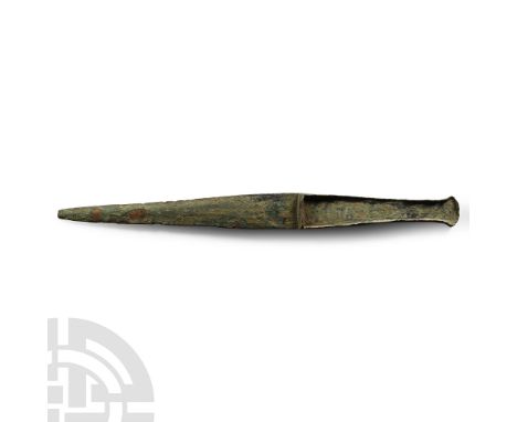 12th century B.C. With lentoid-section blade, tongue-shaped in plan with integral tapering hilt with flared finial, lateral f