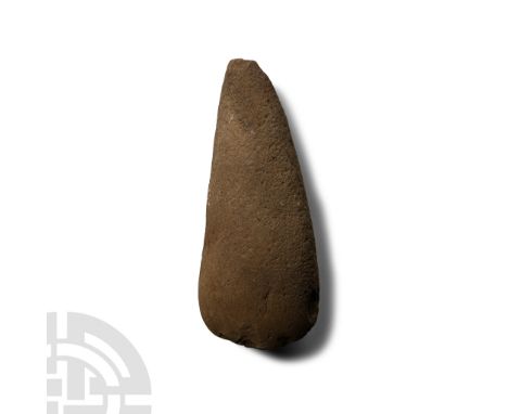 Neolithic Period, circa 4th-3rd millennium B.C. or later. With broad curved blade, ellipsoid-section body, narrow butt; chipp