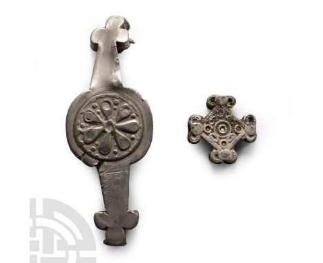 14th-16th century A.D. Comprising: a strap junction formed as two lozengiform plates with lobed finial to each arm, enamel de