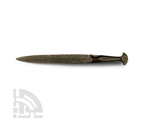 13th-7th century B.C. With lentoid-section blade, tongue-shaped in plan with integral tapering hilt with flared finial, later