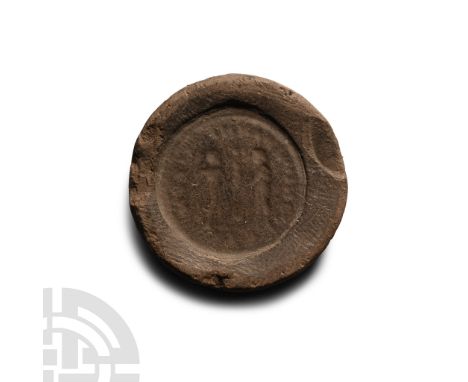 1st-4th century A.D. Discoid in plan, the obverse with profile bust of an emperor wearing a radiate crown, legend surrounding