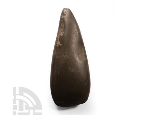 Neolithic Period, circa 4th millennium B.C. Polished cordate form with pointed butt.  900 grams, 21 cm (8 1/4 in.). [No Reser