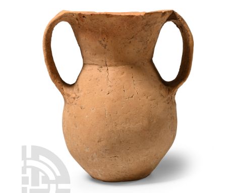 Neolithic Period, 3rd millennium B.C. Comprising a bulbous body, conical neck, two lateral strap handles.  190 grams, 11.3 cm