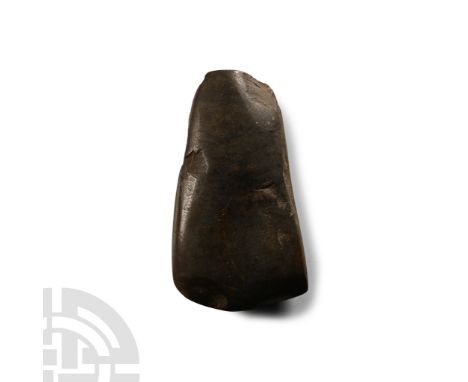 Neolithic Period, circa 4th-3rd millennium B.C. Rectangular in section with mottled polished surface, narrow butt; old collec