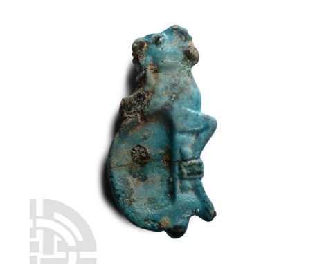 Late Period, 664-332 B.C. Turquoise glazed faience figure of a trussed ibex, with the remains of its large curled horn, tail,