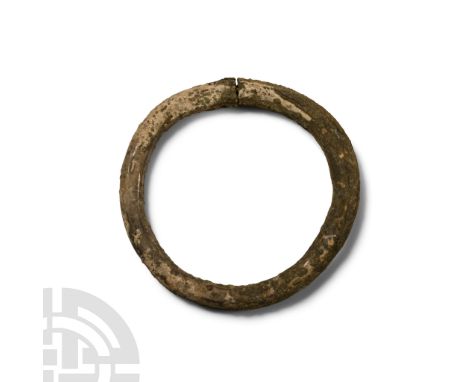 Late Bronze Age, 1st millennium B.C. Round in section with butted ends; some delamination.  82 grams, 75 mm (3 in.). [No Rese