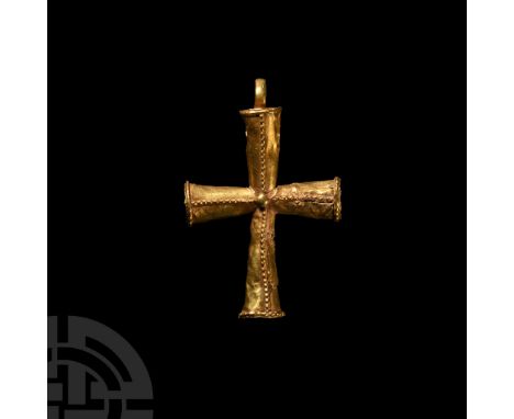 5th-6th century A.D. Hollow-formed sheet gold cruciform pendant with filigree ropework to the end of each expanding tubular a