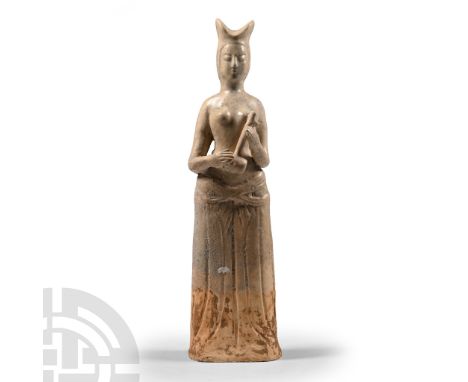 Song Dynasty, 960-1279 A.D. or later. Modelled in the round figure of a lady in floor-length robes with hands holding a music