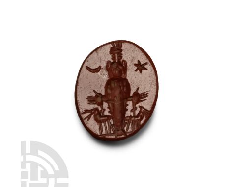 2nd-3rd century A.D. Intaglio figure of Diana facing, flanked by a crescent moon and star.  0.50 grams, 12 mm (1/2 in.).From 