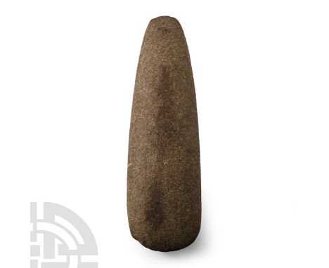 Neolithic Period, circa 4th-3rd millennium B.C. Ovoid in section with rounded butt and curved cutting edge.  1.1 kg, 22.5 cm 