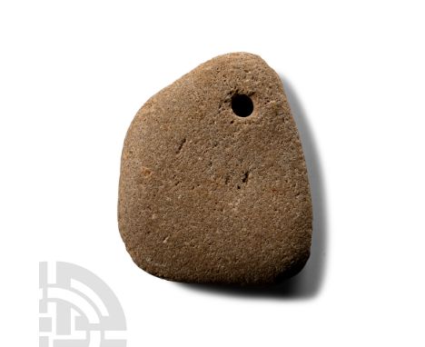Neolithic Period, circa 4th-3rd millennium B.C. or later. Triangular in profile with ground hole below the apex; chipped.  25