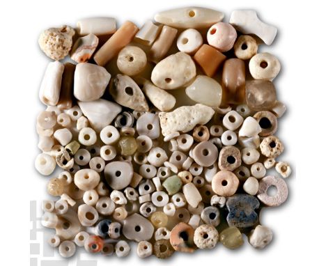 Circa 1st millennium B.C. and later. Composed of graduated beads of various types of white stone, rock crystal, glass, coral 