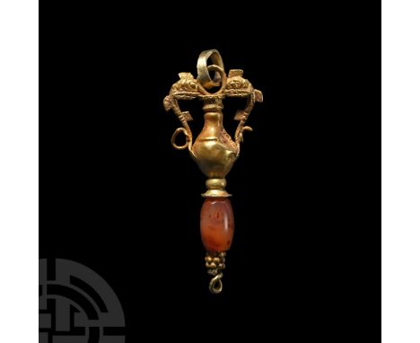 2nd-1st century B.C. Formed as an amphora with dolphin handles, oval carnelian bead below with granulated collar; loop and su