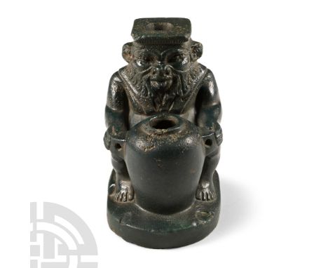 Late Period-Ptolemaic Period, 6th-2nd century B.C. Carved in the round figure of Bes sitting on an ellipsoid base; the god in