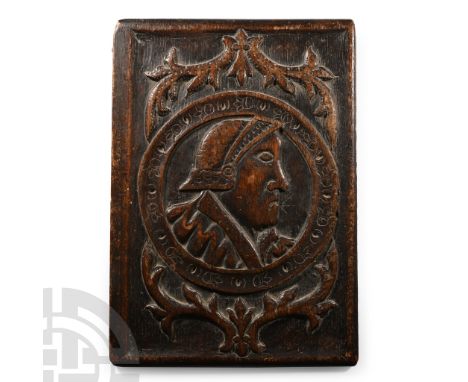 16th-17th century A.D. Cupboard door with rounded frame, carved central ring with foliage clusters above and below, profile p