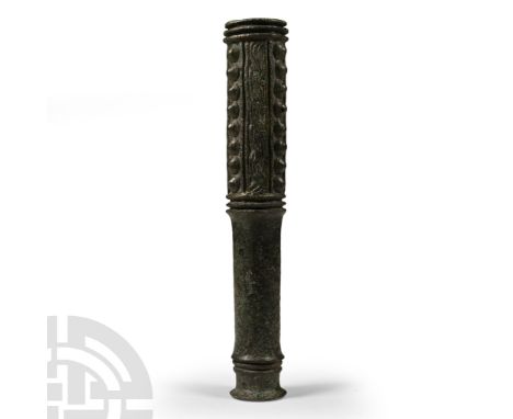 Early 2nd millennium B.C. Comprising a long cylindrical shaft with narrow flanged base, the upper section with three vertical