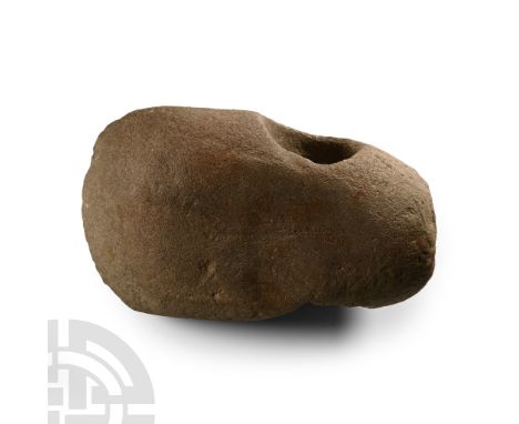 Neolithic Period, circa 4th-3rd millennium B.C. With hammer-face to the butt, thick edge, scooped rims to the socket. Cf. Mac