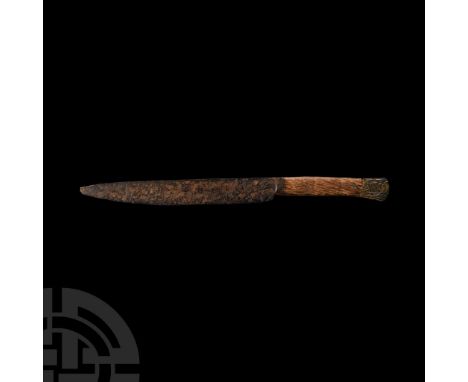 Circa 1500 A.D. Comprising a single cutting edge and scale tang, bifacial pommel incised with a female figure possibly holdin