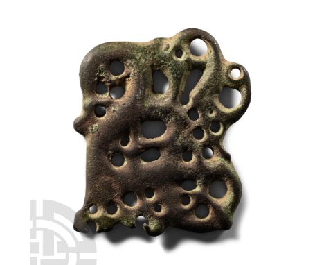 11th century A.D. Openwork interlace plaque with Urnes Style stag and serpent, attachment points at outer edge. Cf. Roesdahl,