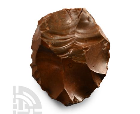Lower Palaeolithic Period, 450,000-280,000 B.C. With rounded butt and cutting edge.  236 grams, 89 mm (3 1/2 in.). [No Reserv