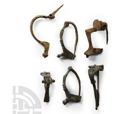 1st-3rd century A.D. Comprising six bow brooches of different types, one with tinned decoration; four with pins in situ, two 