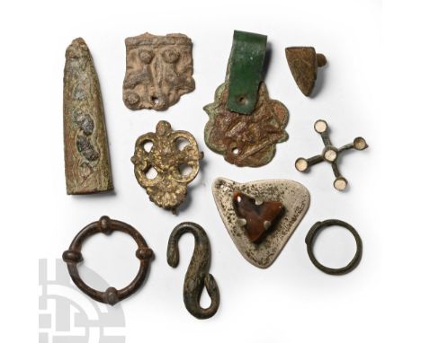 14th-19th century A.D. Including a dagger chape, heater-shaped heraldic badge, finger ring and other items.  87 grams total, 