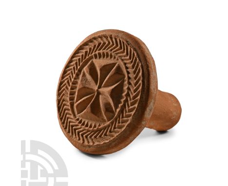 10th-11th century A.D. Discoid in plan with integral stub handle; central Maltese cross within a herringbone ring.  319 grams