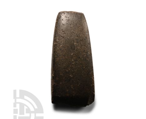 Neolithic Period, circa 4th-3rd millennium B.C. Rectangular in section with thick butt, bevelled cutting edge; old collector'