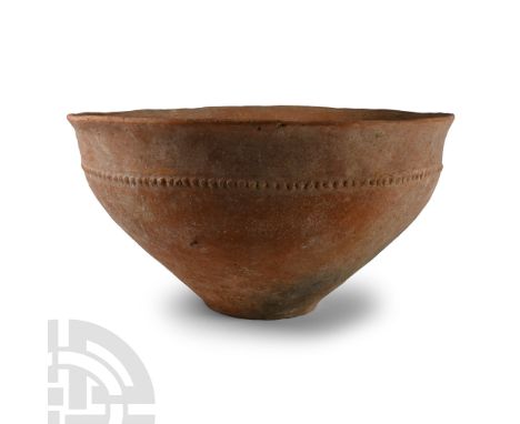 Early Bronze Age I, 2nd millennium B.C. Bell-shaped in profile with everted rim, band of pellets to the shoulder.  1.7 kg, 31
