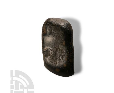 Neolithic Period, circa 4th-3rd millennium B.C. With broad curved edge and flat rear striking face; shank smoothed but unfini