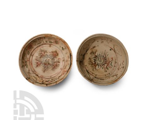 15th century A.D. Both with painted petals to the outer faces, painted bichrome design of vegetal motifs surrounding a Chines