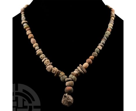 1st millennium B.C. and later. Composed mainly of oblate and annular beads, restrung to a Y-shape with a central irregular pe