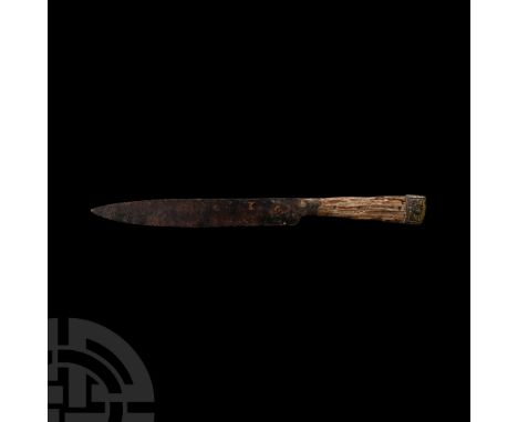 Early to mid-15th century A.D. Comprising a single cutting edge and scale tang; bifacial pommel engraved with a foliate motif
