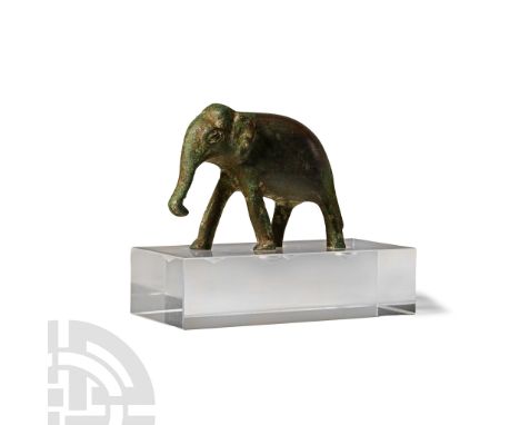 Circa 18th-19th century A.D. In advancing pose with trunk extended, tail draped along the hindleg; old inked number '27' to u