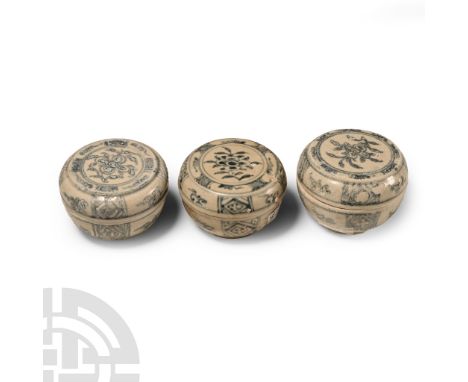 15th century A.D. Comprising three powder boxes with painted flower to the lid and sidewall.  365 grams total, 71-73 mm (2 3/