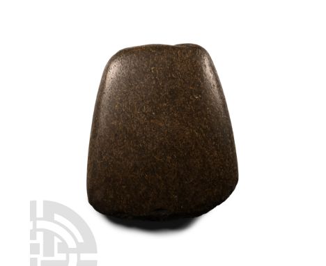 Neolithic Period, circa 4th-3rd millennium B.C. Lentoid in section and trapezoidal in plan; old inked find spot legend 'Giant