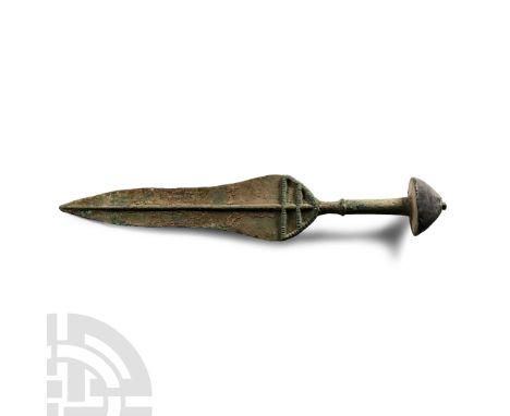 Late 2nd millennium-early 1st millennium B.C. The hilt with mushroom-shaped pommel, round grip, crescentic guard with double 