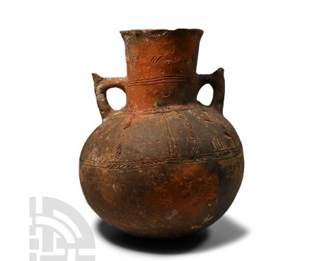 Early Bronze Age, 2300-2150 B.C. The bulbous body and columnar neck decorated with bands of impressed-cord detailing, shoulde