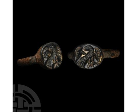 6th-7th century B.C. Discoid bezel with intaglio profile eagle with head turned and wings raised.  5.55 grams, 25.49 mm overa