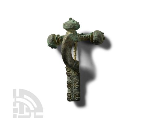 3rd-4th century A.D. With three facetted knops to the crossbar, the upper one with beaded collar, and pierced moulding to the