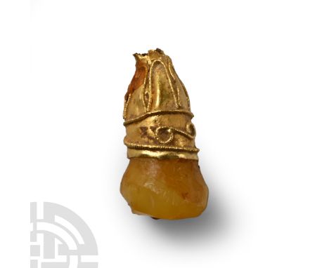 9th-11th century A.D. or earlier. Decorated sheet gold sleeve, hoof-shaped stone mounted in the socket; loop absent.  0.18 gr