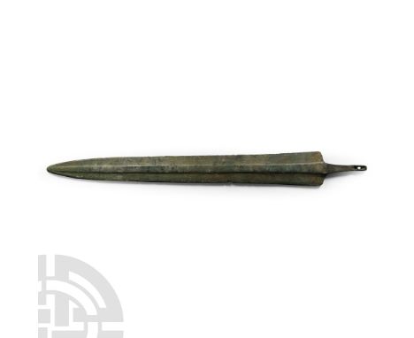 1st millennium B.C. With rounded shoulders and square-sectioned mid-rib running to the blade tip; short tang with fastening h