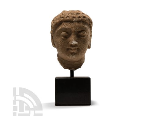 3rd-5th century A.D. Modelled with fine facial features, arched brows, long earlobes; mounted on a custom-made stand. Cf. Jon