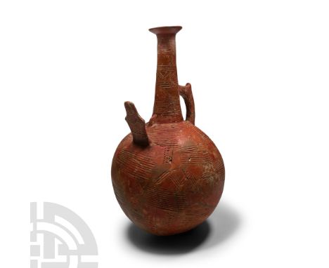 Early Bronze Age III-Middle Bronze Age I, circa 2100-1850 B.C. With globular body, tall tubular neck and flared mouth; circum